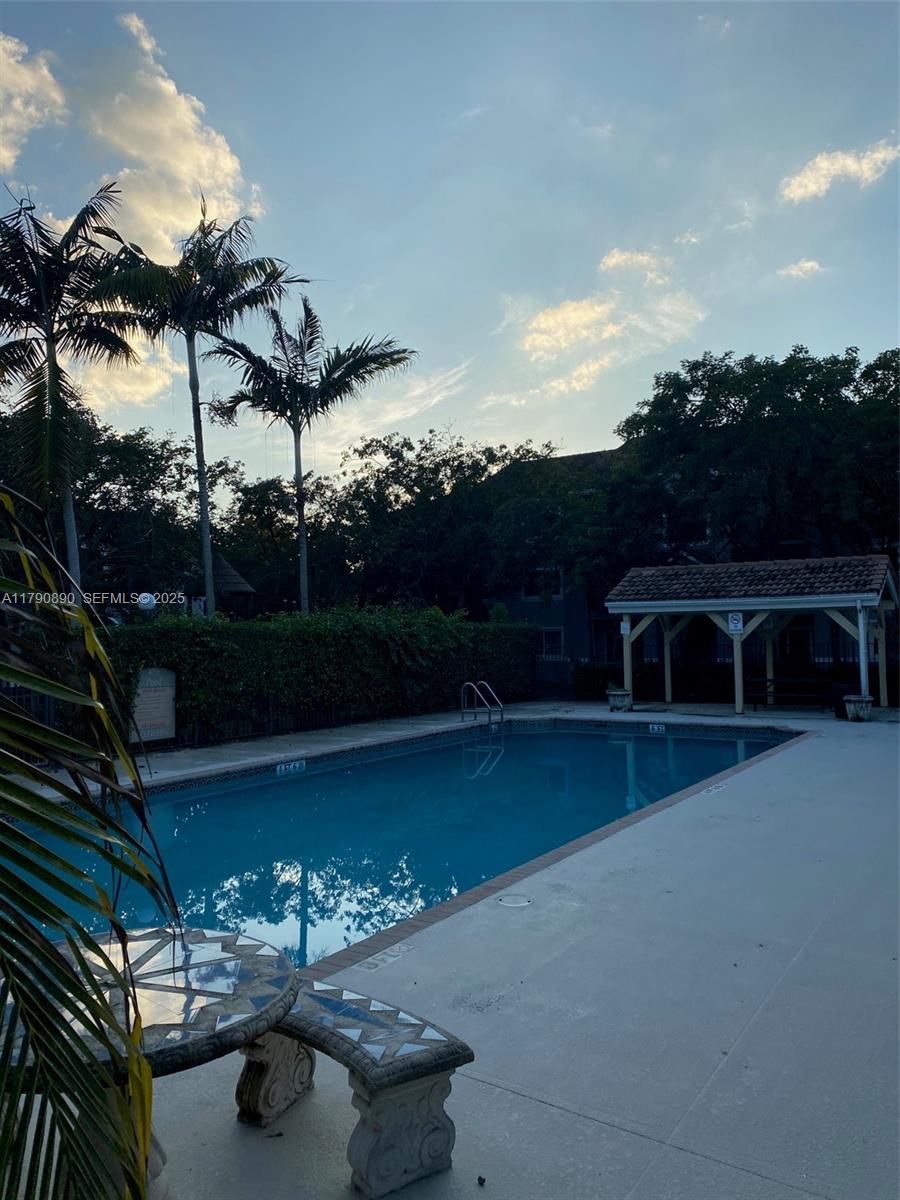 15422 Southwest 284th Street, Unit 7104 Homestead, FL 33033 - Photo 29 of 31 a view of a backyard with plants hardwood and patio