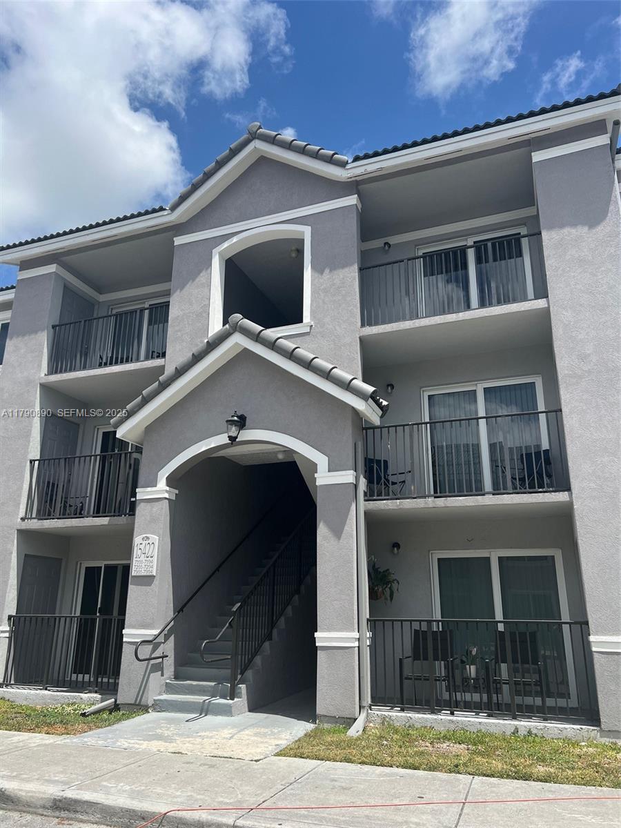 15422 Southwest 284th Street, Unit 7104 Homestead, FL 33033 - Photo 31 of 31 a front view of a house with a yard