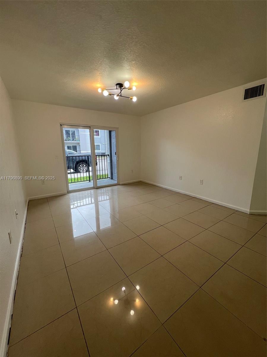 15422 Southwest 284th Street, Unit 7104 Homestead, FL 33033 - Photo 5 of 31 a view of a room window and stairs