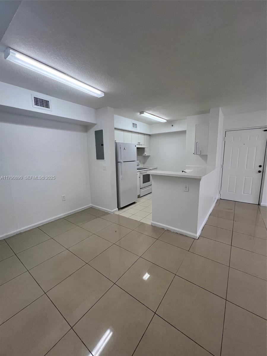 15422 Southwest 284th Street, Unit 7104 Homestead, FL 33033 - Photo 10 of 31 a view of a kitchen with a dishwasher and a cabinets