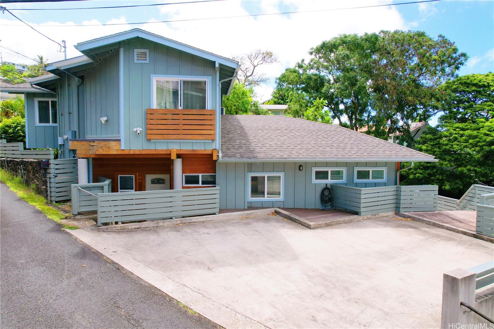 2578 Pacific Heights Road Honolulu, HI 96813 - Photo 1 of 25 a front view of a house with a yard and garage