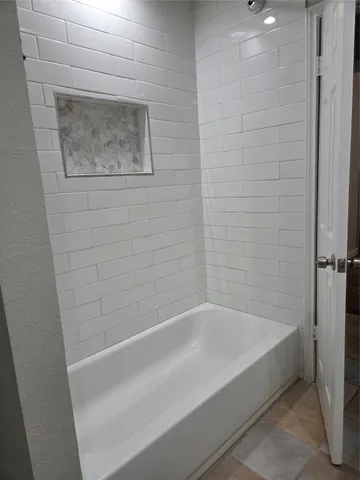 a close view of a bathtub in bathroom