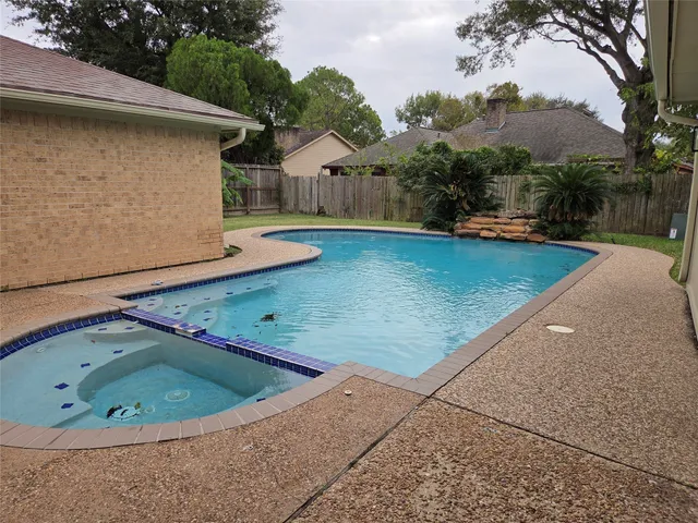 a view of a backyard with a tub