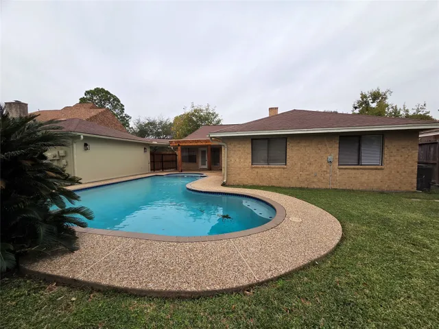 a view of outdoor space yard and swimming pool