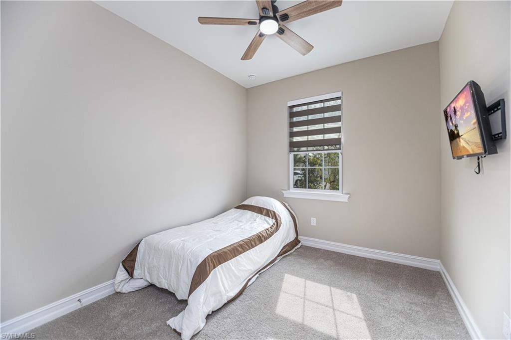 1003 Enbrook Loop Naples, FL 34114 - Photo 15 of 20 a bedroom with a bed and window