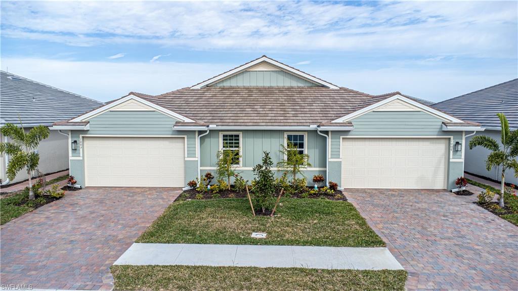 1003 Enbrook Loop Naples, FL 34114 - Photo 18 of 20 front view of house with a yard