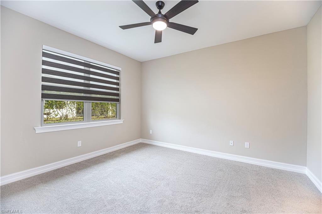 1003 Enbrook Loop Naples, FL 34114 - Photo 4 of 20 a view of an empty room with a window