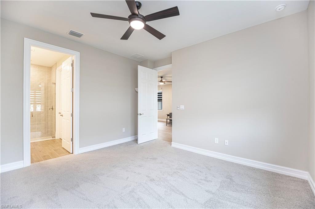 1003 Enbrook Loop Naples, FL 34114 - Photo 5 of 20 a view of an empty room and window