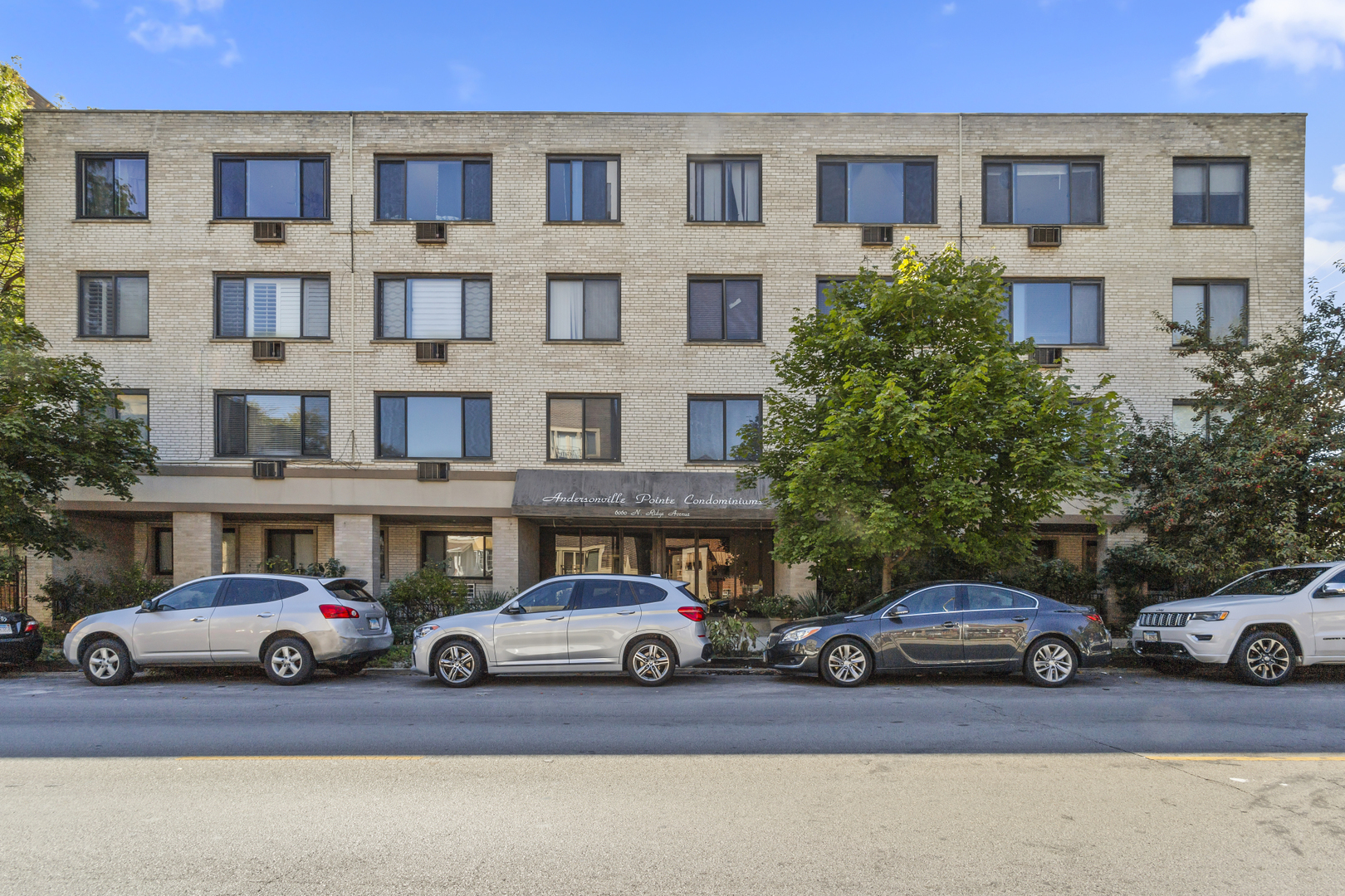 6060 North Ridge Avenue, Unit 2H Chicago, IL 60660 - Photo 1 of 23 a view of a cars parked in front of a building