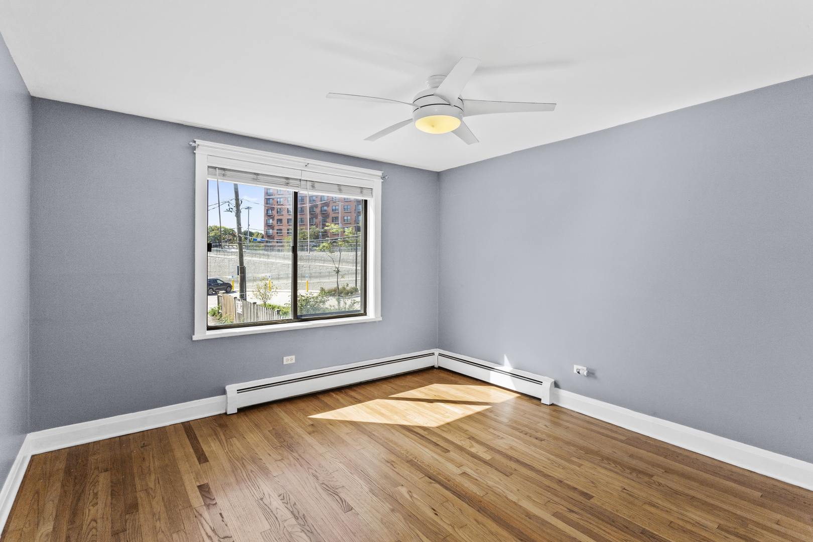 6060 North Ridge Avenue, Unit 2H Chicago, IL 60660 - Photo 11 of 23 an empty room with a window