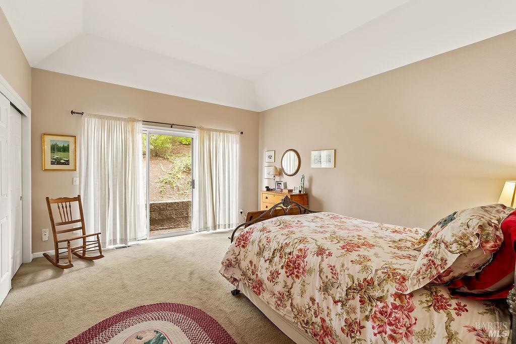 6252 Meadowstone Drive Santa Rosa, CA 95409 - Photo 29 of 33 a bed sitting in a bedroom next to a window with tv