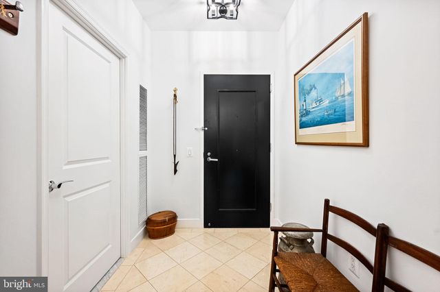 a view of a hallway with furniture and entryway