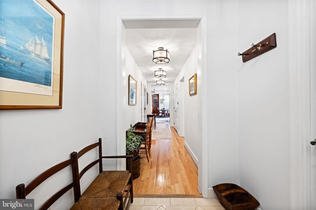 a room with furniture pool table and window