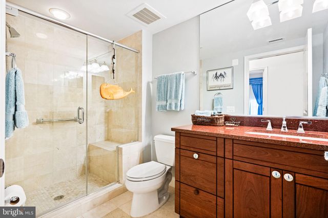 a bed room with a bed and a chair