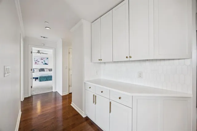 a bed room with a bed and a chandelier