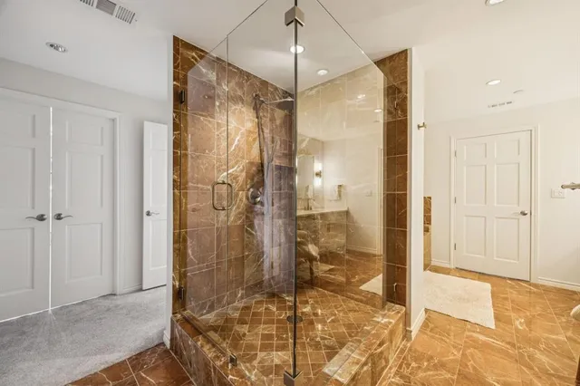 walk in closet with a large window