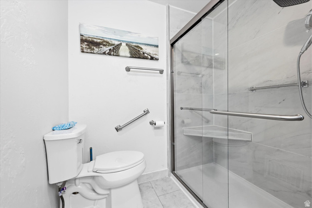 292 West 400 South Springville, UT 84663 - Photo 23 of 37 Contemporary bathroom featuring a spacious glass-enclosed shower with a built-in corner shelf and a sliding door