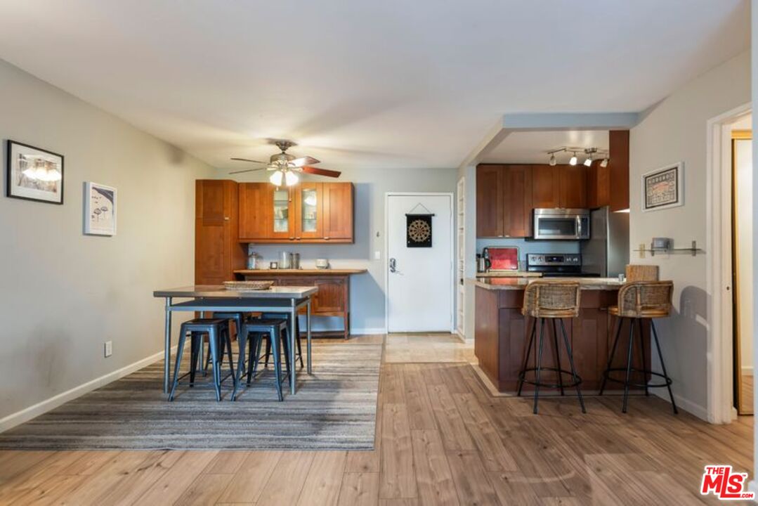 7765 West 91st Street, Unit A2117 Playa del Rey, CA 90293 - Photo 11 of 27 a kitchen with a table and chairs in it