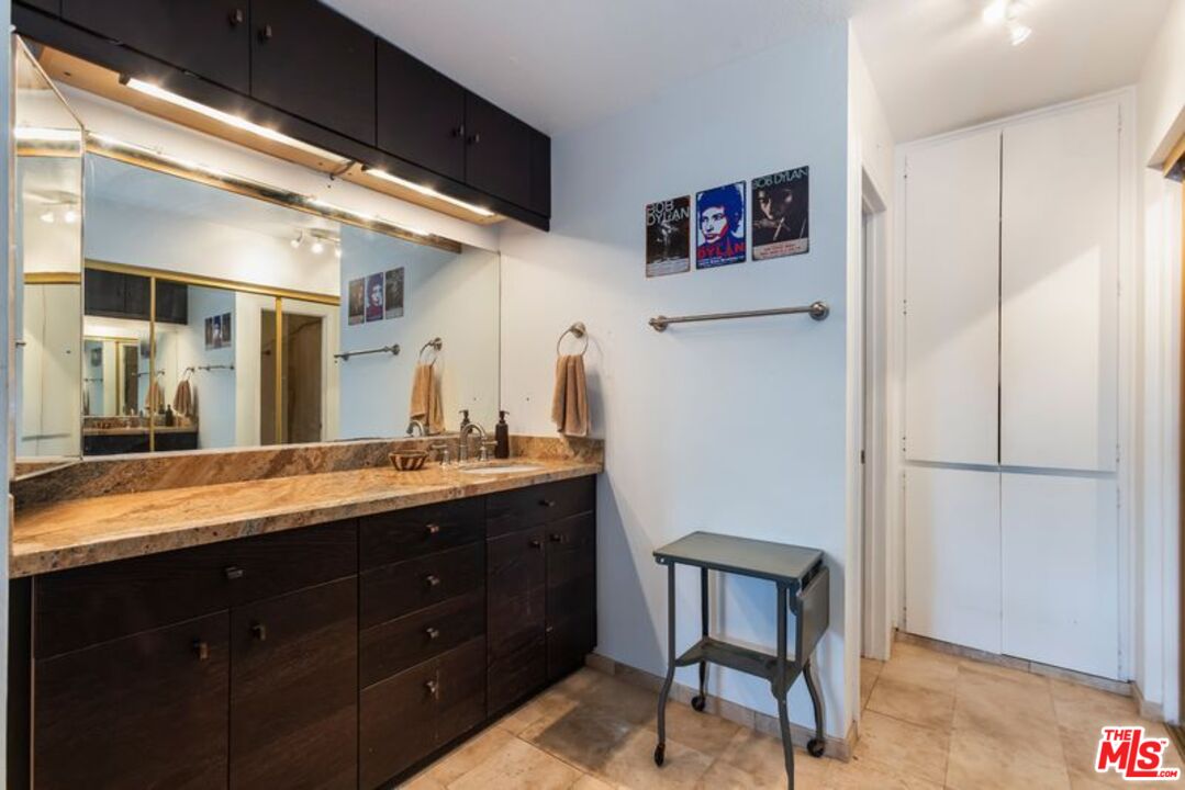 7765 West 91st Street, Unit A2117 Playa del Rey, CA 90293 - Photo 17 of 27 a spacious bathroom with a granite countertop sink a mirror and a