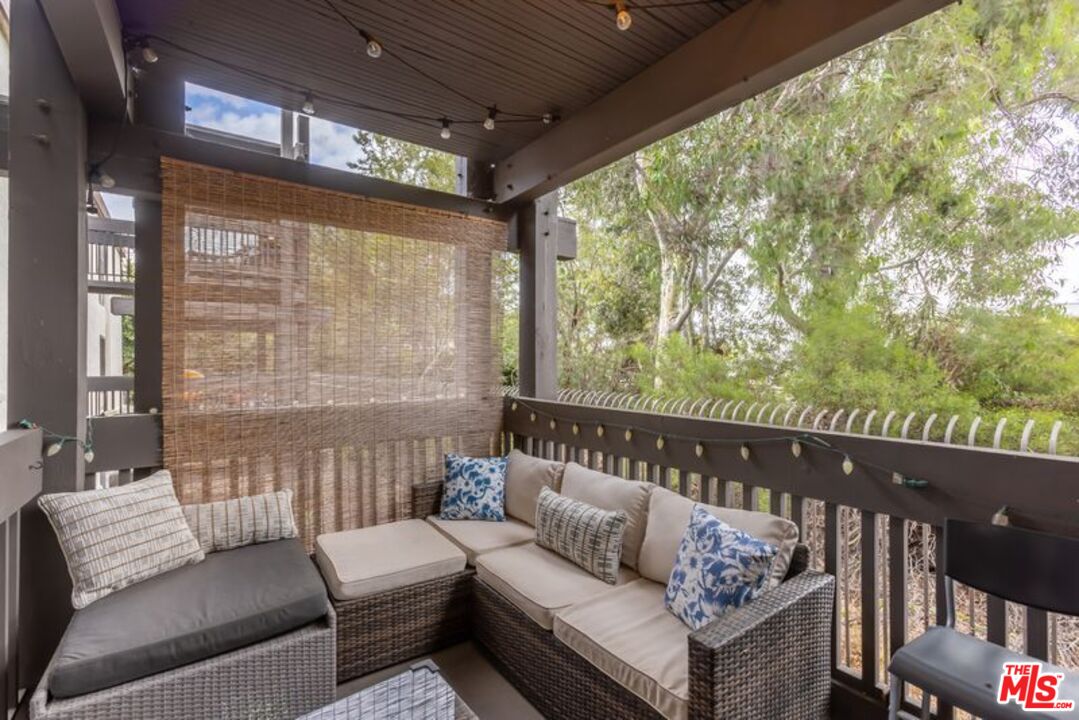7765 West 91st Street, Unit A2117 Playa del Rey, CA 90293 - Photo 23 of 27 a living room with furniture and a large window