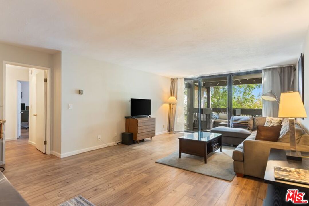 7765 West 91st Street, Unit A2117 Playa del Rey, CA 90293 - Photo 5 of 27 a living room with furniture and a flat screen tv