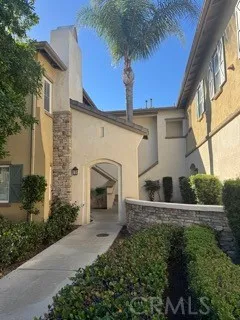 a view of a house with palm trees