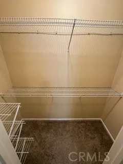 a bathroom with a sink mirror vanity and toilet
