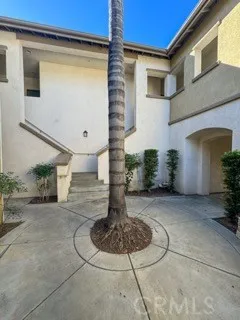 a view of a house with more windows and plants