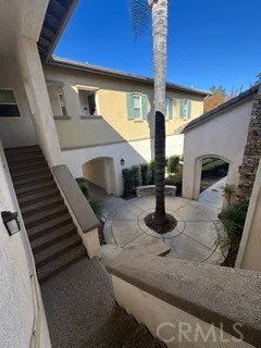 a front view of a house with stairs