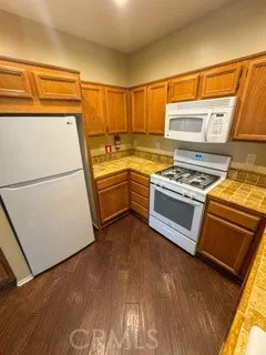 a kitchen with a stove and a refrigerator