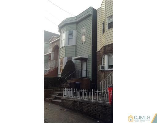 a view of a building with a small yard