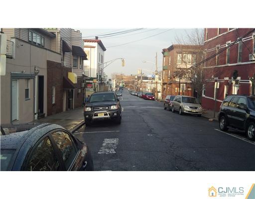 717 16th Street Union City, NJ 07087 - Photo 5 of 8 a black car parked in front of a building
