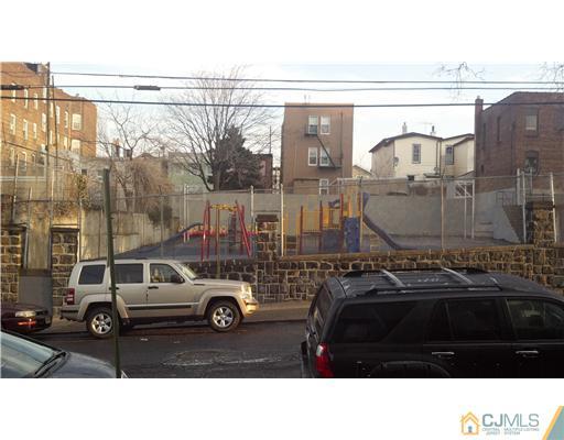 717 16th Street Union City, NJ 07087 - Photo 6 of 8 a car parked on the side of a street