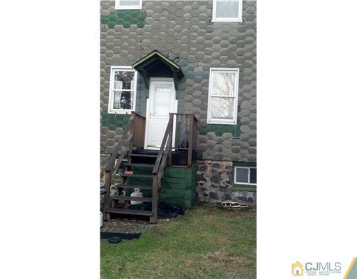 717 16th Street Union City, NJ 07087 - Photo 7 of 8 a front view of a house with garden