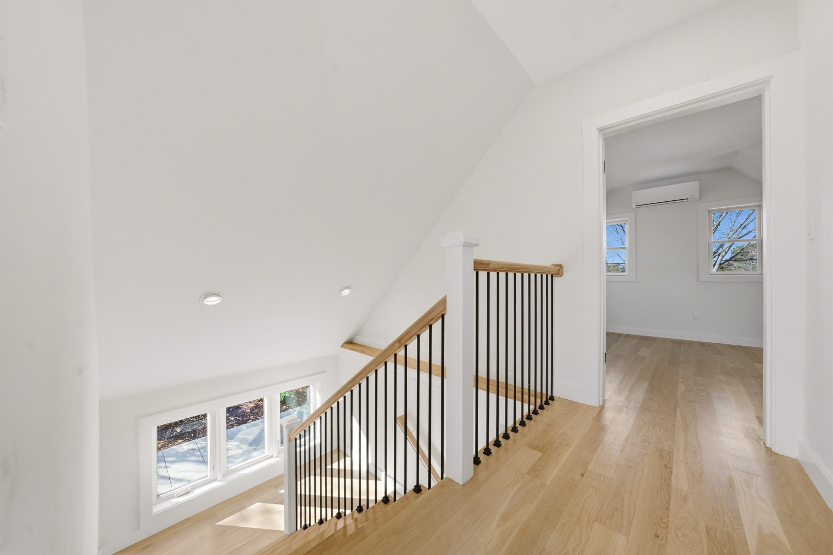 38 Hooper Farm Road Nantucket, MA 02554 - Photo 14 of 19 a view of a hallway with wooden floor and windows