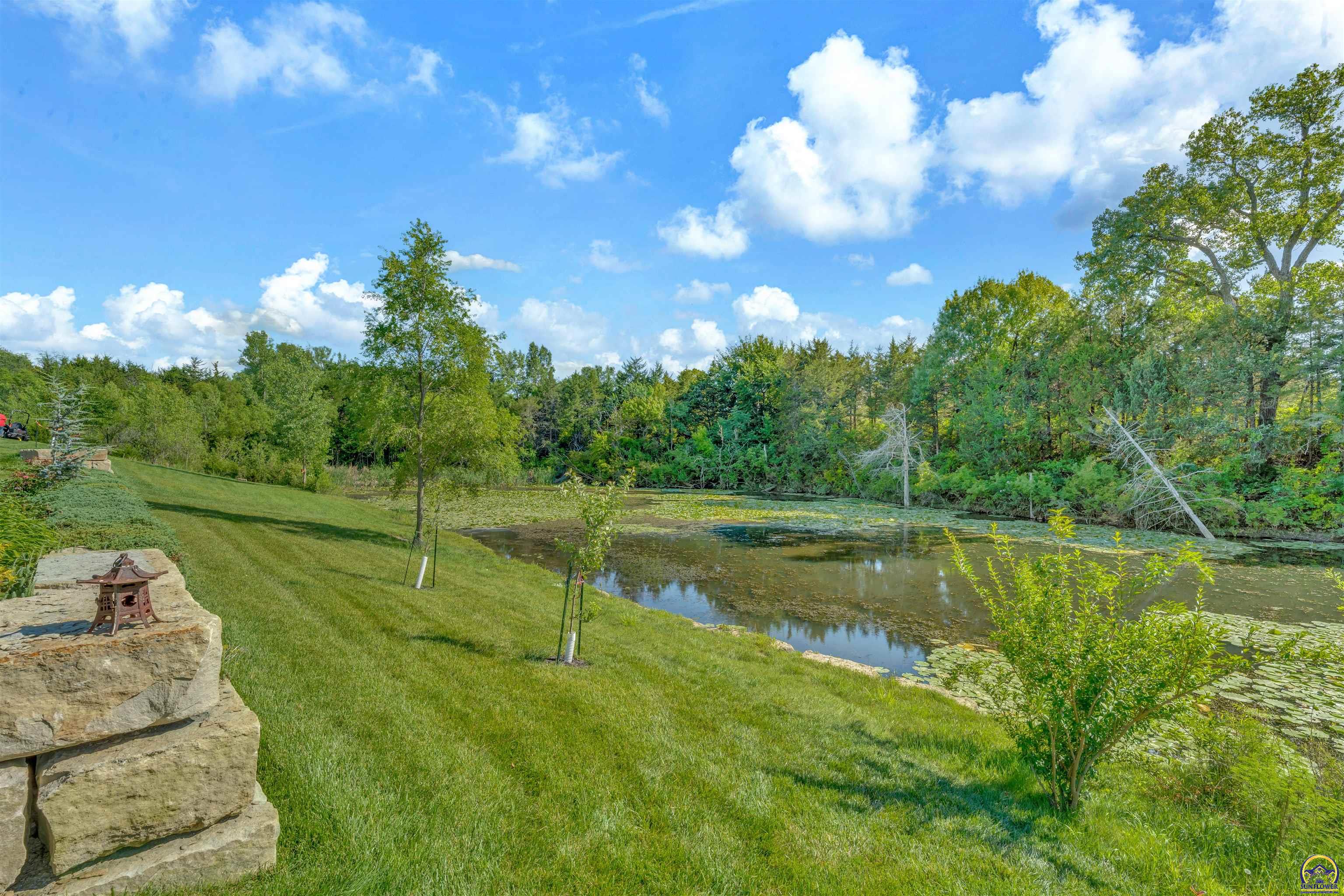 6131 Southwest 47th Street Topeka, KS 66610 - Photo 14 of 20 Back Yard Faces Laurens Bay Pond