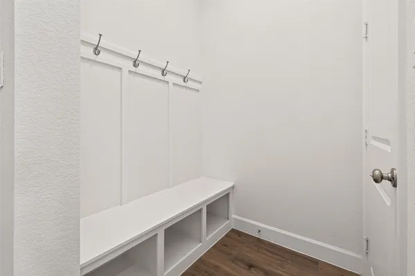 a large kitchen with a sink stainless steel appliances and cabinets