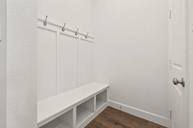 a large kitchen with a sink stainless steel appliances and cabinets