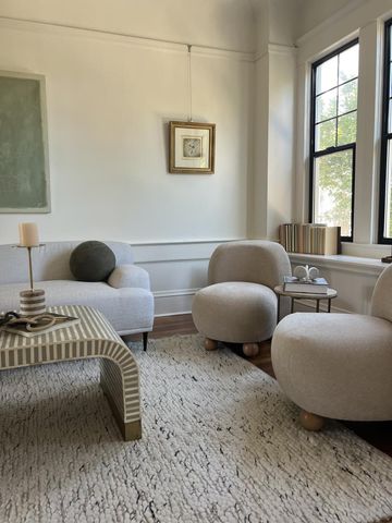 a bedroom with two beds and a window