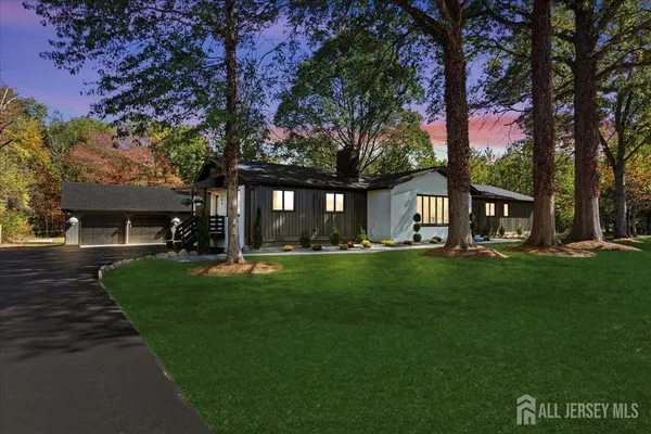 a view of house with backyard