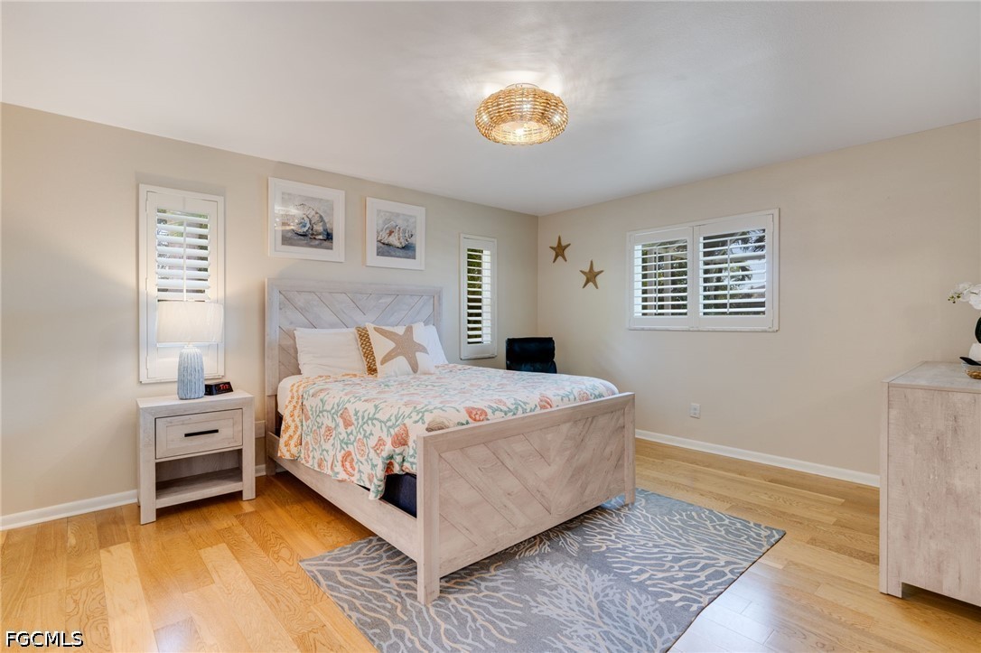2912 Southwest 1st Terrace Cape Coral, FL 33991 - Photo 11 of 31 a bedroom with a bed and a window