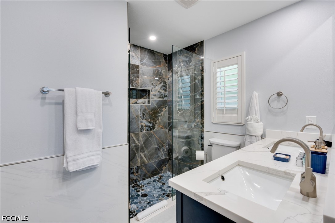 2912 Southwest 1st Terrace Cape Coral, FL 33991 - Photo 13 of 31 a bathroom with a sink and a mirror