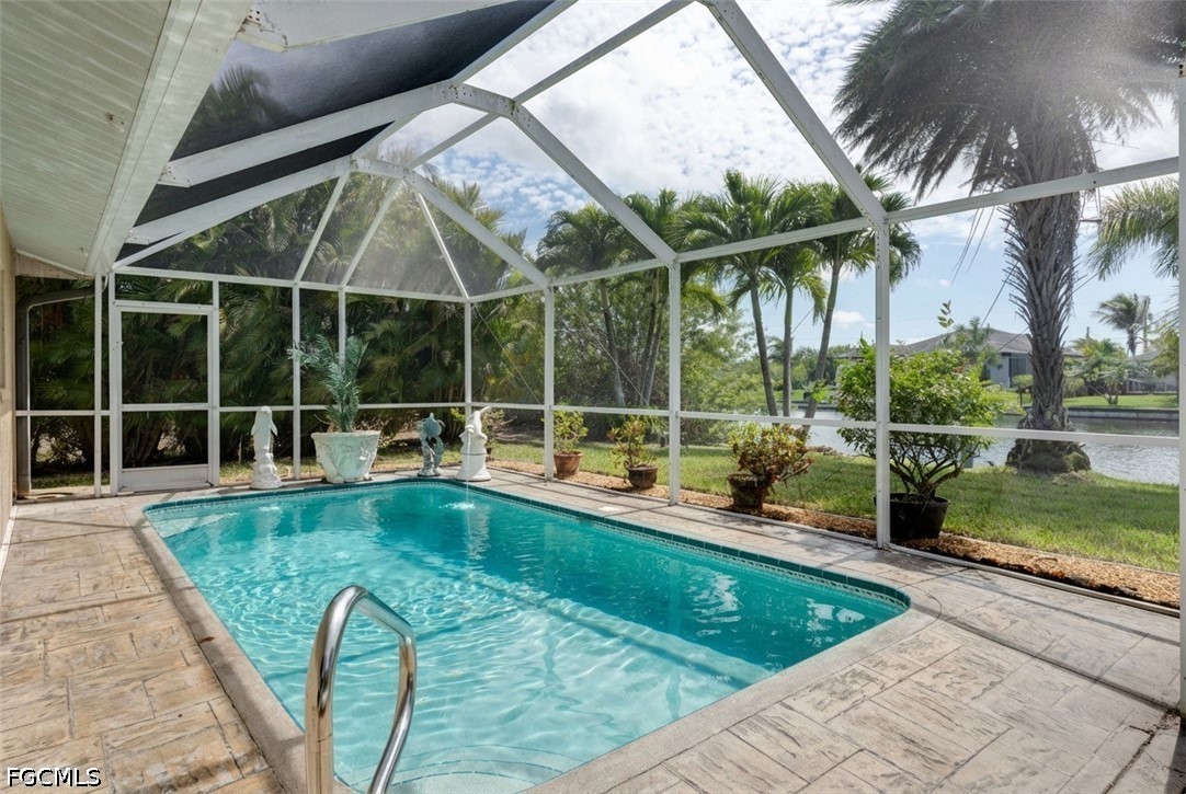 2912 Southwest 1st Terrace Cape Coral, FL 33991 - Photo 18 of 31 a view of a backyard with swimming pool