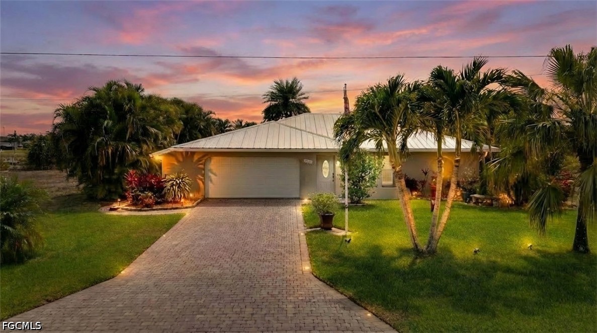 2912 Southwest 1st Terrace Cape Coral, FL 33991 - Photo 2 of 31 a view of a backyard with a garden