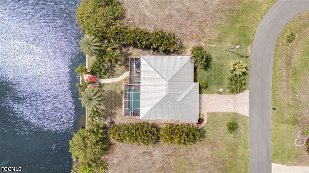 2912 Southwest 1st Terrace Cape Coral, FL 33991 - Photo 29 of 31 front view of a house with a yard