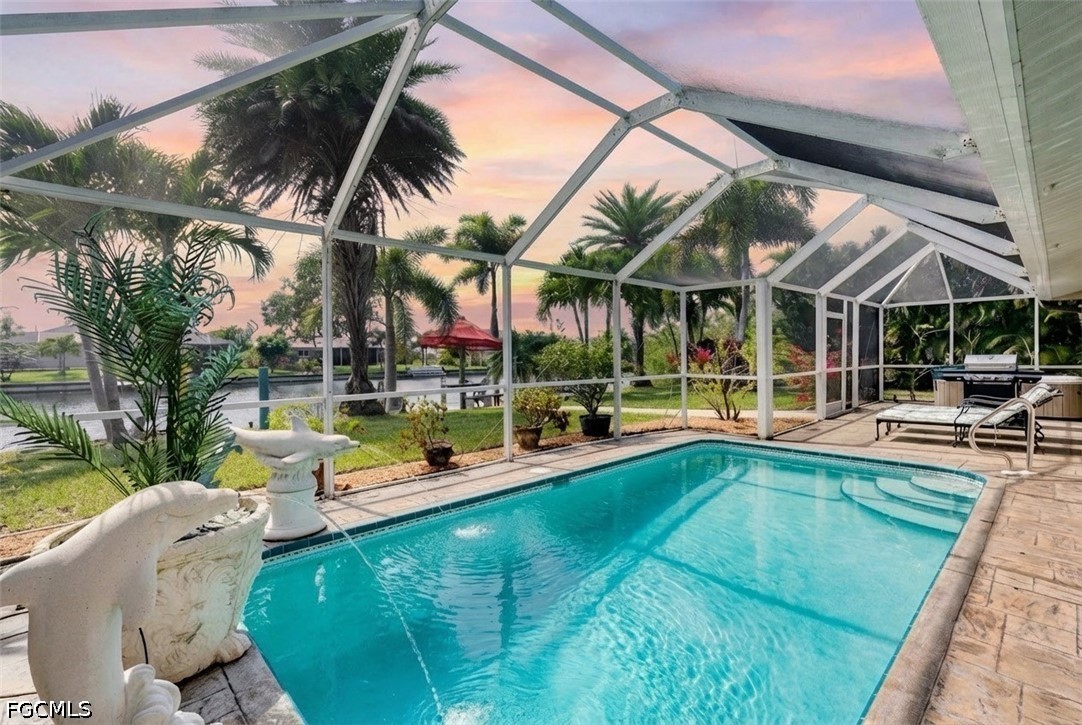2912 Southwest 1st Terrace Cape Coral, FL 33991 - Photo 3 of 31 a view of a swimming pool with a patio