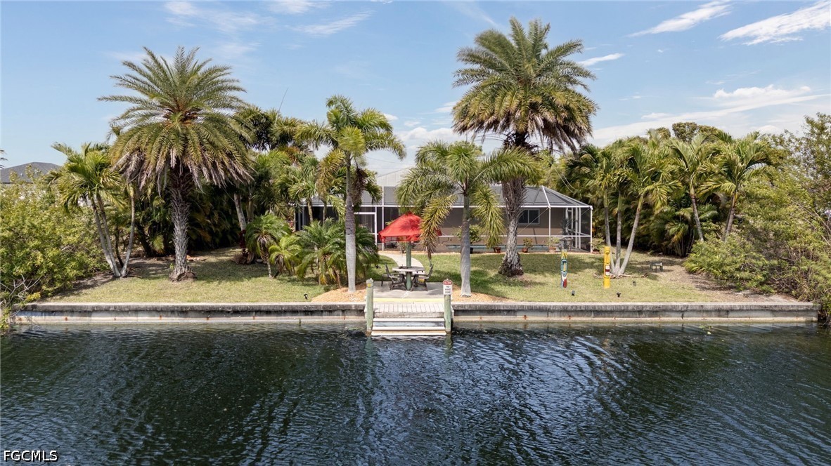 2912 Southwest 1st Terrace Cape Coral, FL 33991 - Photo 4 of 31 a view of swimming pool with palm trees