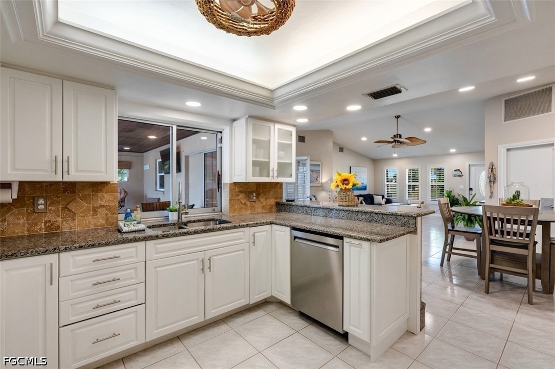 2912 Southwest 1st Terrace Cape Coral, FL 33991 - Photo 6 of 31 a kitchen with a sink and cabinets