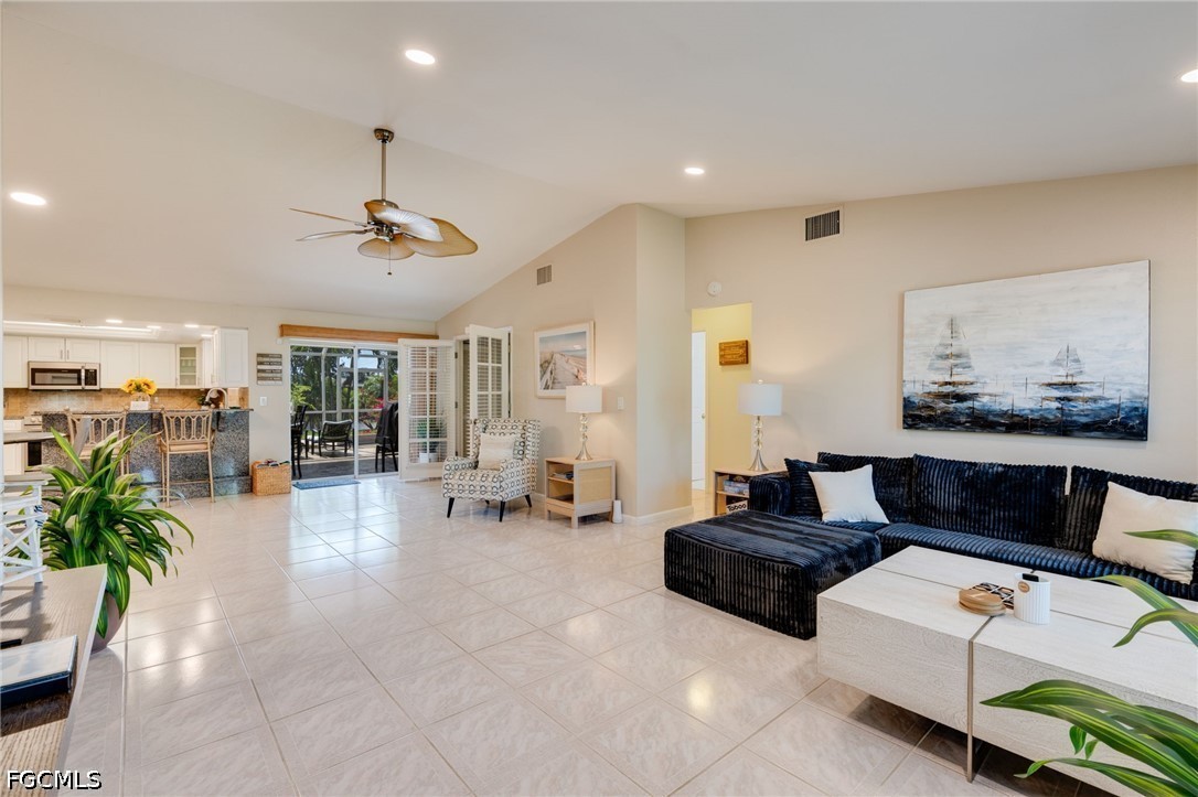 2912 Southwest 1st Terrace Cape Coral, FL 33991 - Photo 8 of 31 a living room with furniture and a potted plant