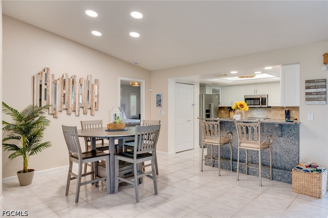 2912 Southwest 1st Terrace Cape Coral, FL 33991 - Photo 10 of 31 a view of a dining room with furniture